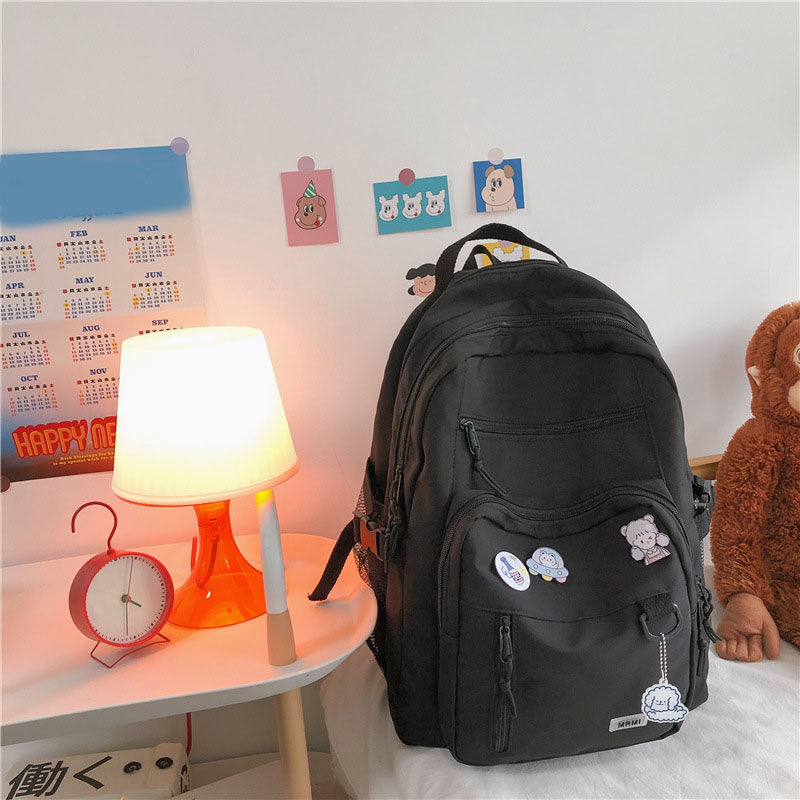 Sac à dos grande capacité pour filles et étudiantes, imperméable, multi-poches, bretelles confortables. Disponible en 4 coloris. Idéal pour l'école et le quotidien.