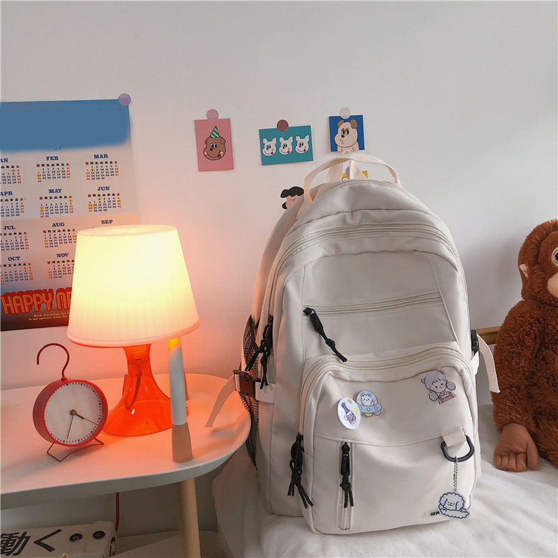 Sac à dos grande capacité pour filles et étudiantes, imperméable, multi-poches, bretelles confortables. Disponible en 4 coloris. Idéal pour l'école et le quotidien.